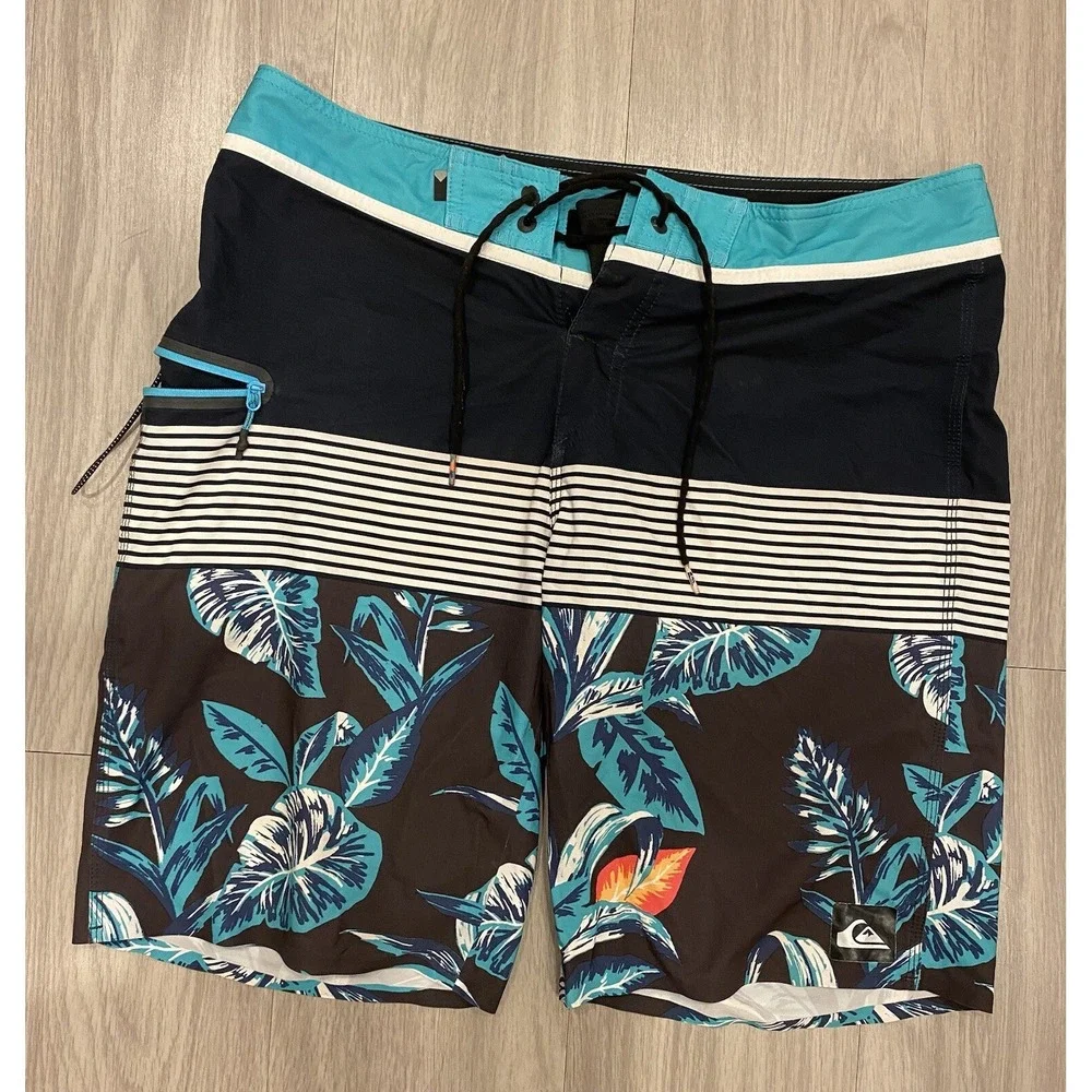 Quiksilver Men's Size 32 Board Shorts Swimsuit Blue Floral Swim Trunks *Preowned